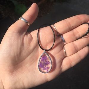 Teardrop shaped resin pendant with real flower